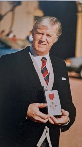 Colin Evans with his OBE in 1989
