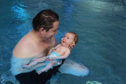 Glyn and Max Harding in Ty Hafan's pool
