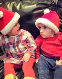 Alfi and Besi wearing Christmas hats