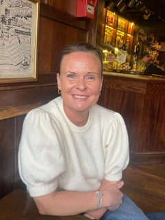 A photo of Jayne smiling at the camera