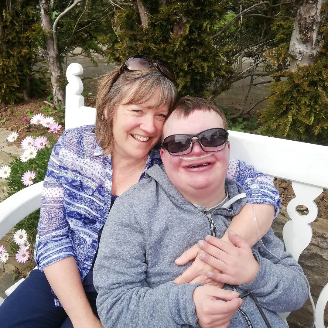 Jackie Fears cuddles her son Greg