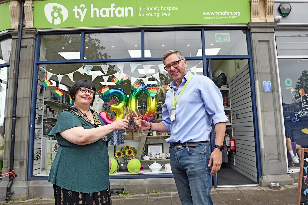 Tŷ Hafan CEO Irfon Rees and Cllr Dawn Ingram-Jones - Aberbargoed & Bargoed, Mayor of Caerphilly make a toast outside the Caerphilly shop