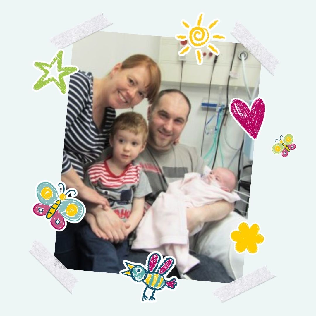 A photo of Angela, Rob, 3 year old Evan and baby Libby in hospital