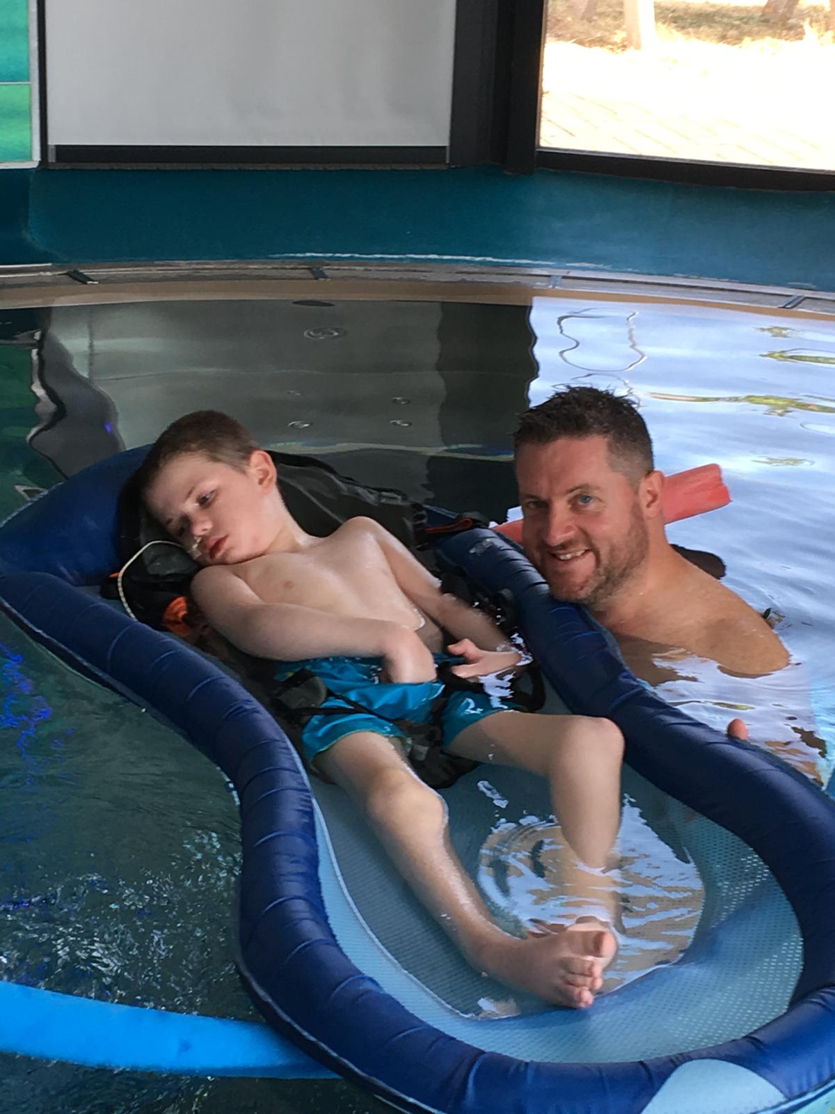 Thomas and James Meacham in Ty Hafan's hydrotherapy pool